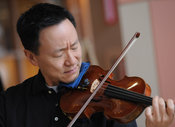 Violinist David Kim plays at Shriners Hospital